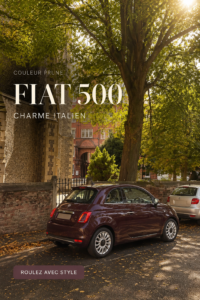 Vue de la nouvelle Fiat 500 dans une rue dynamique, symbolisant le style contemporain.