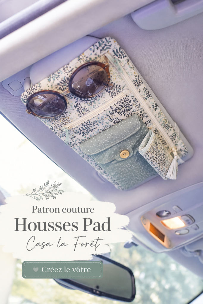 Photo de housses de pad colorées cousues à la main sur une table de couture.