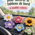 Fleurs au crochet colorées posées sur un tableau de bord de voiture, ajoutant une touche décorative.